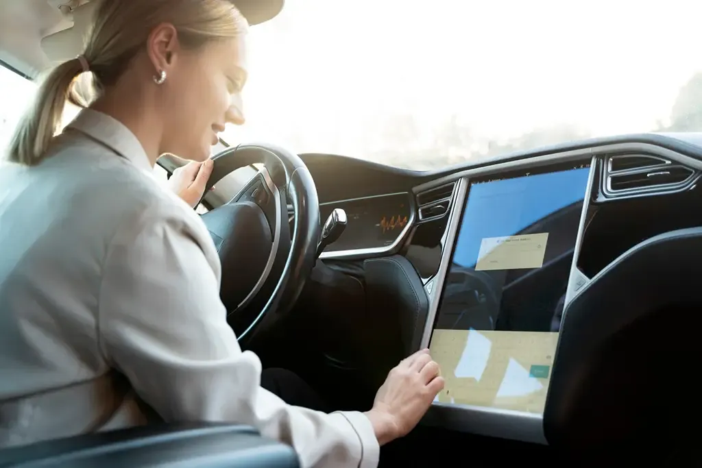 Person interacting with automotive infotainment voice interface